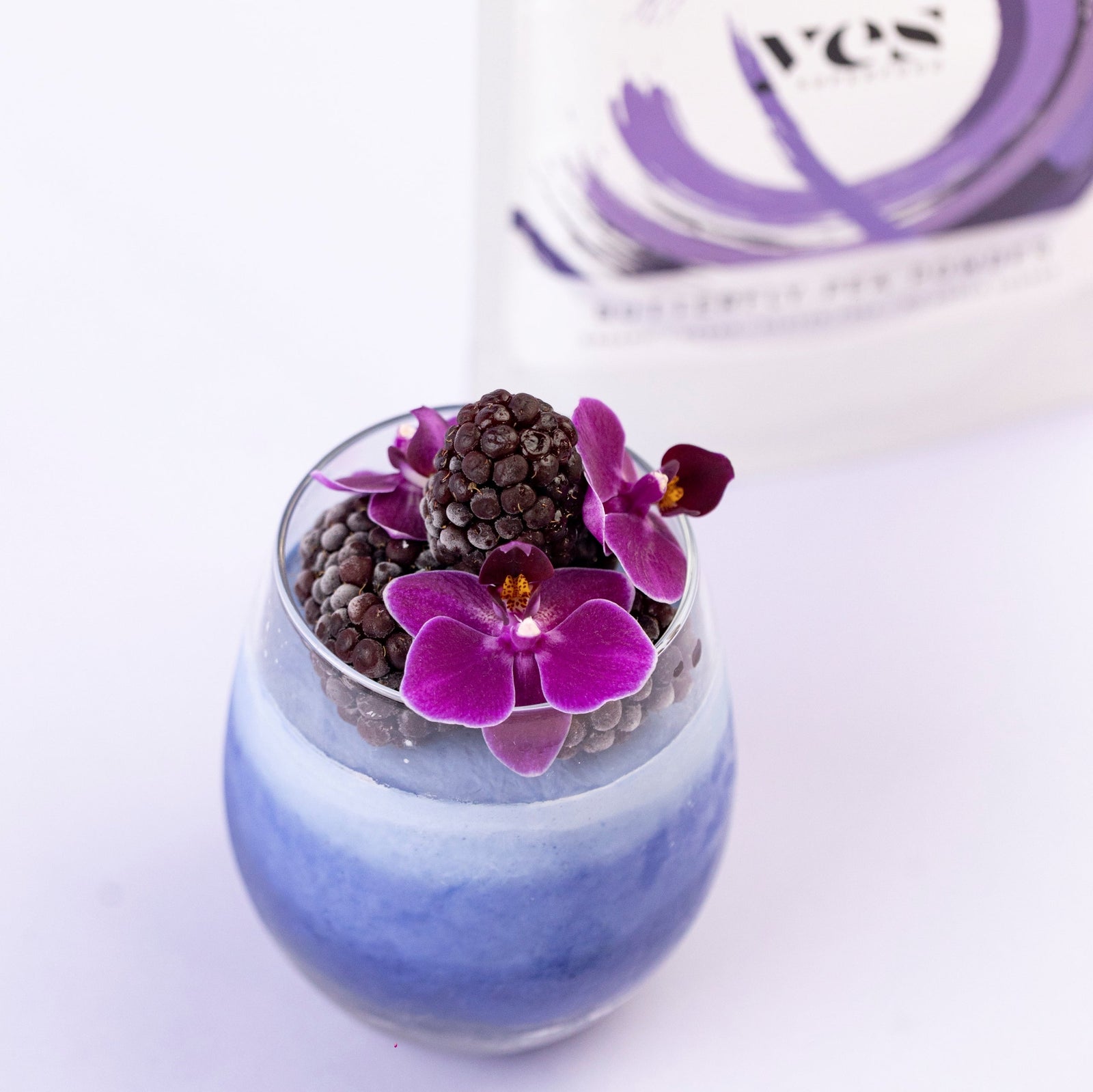 Layered Butterfly Pea Panna Cotta Stunning layered Butterfly Pea Panna Cotta with blue ombré effect served in a glass