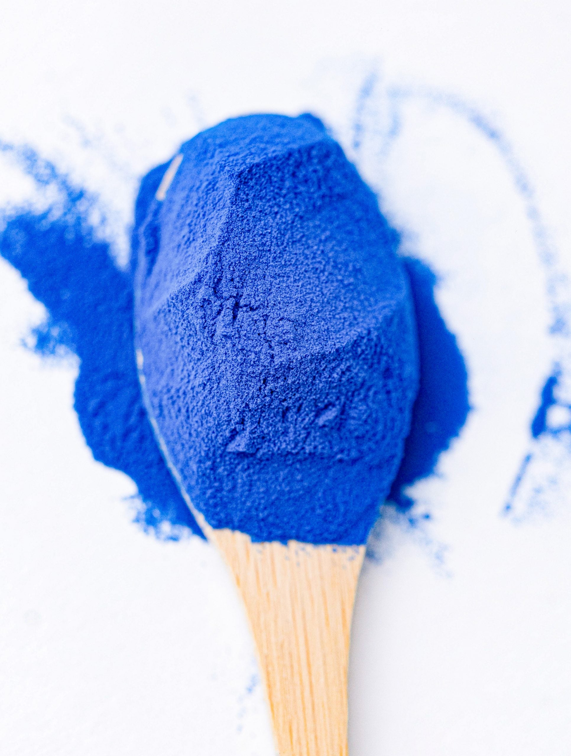 Blue Spirulina powder in a clean, elegant style, for natural food coloring and creative culinary uses.