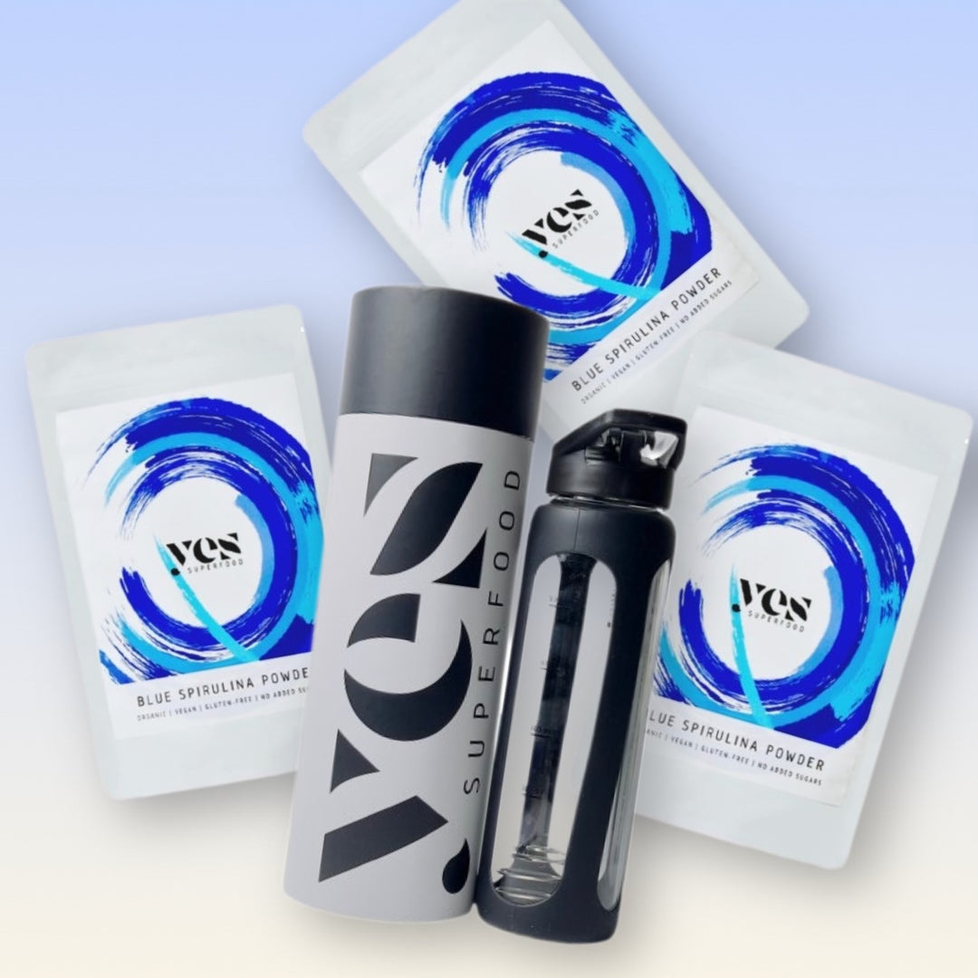 Suprefood Blue Spirulina Powder packages and bottles on a light blue background