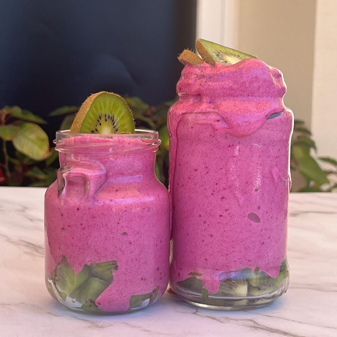Creamy pink smoothie made with Dragon Fruit powder as a natural plant-based colour by Yes Superfood