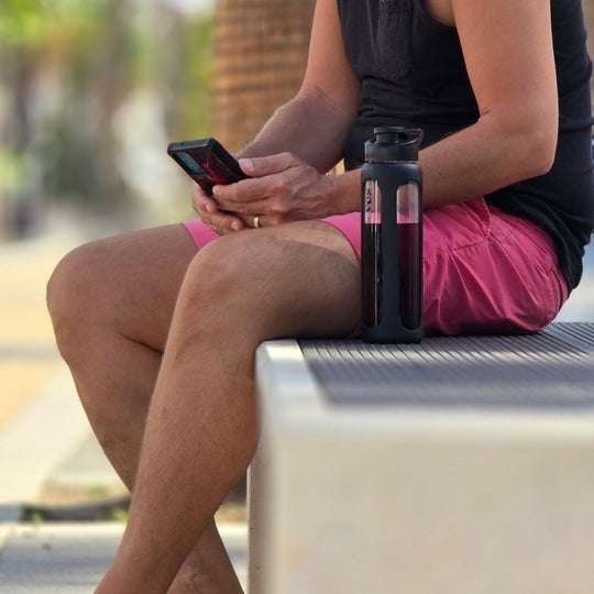 Yes Superfood shaker with a pink superfood drink during an outdoor break